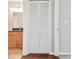 A hallway featuring a set of white shutter doors that lead to the bathroom area at 700 S Harbour Island Blvd # 735, Tampa, FL 33602