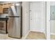 Kitchen featuring stainless steel appliances and wooden cabinets next to the front door at 700 S Harbour Island Blvd # 735, Tampa, FL 33602