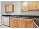 Kitchen featuring granite countertops, wooden cabinets, and a stainless steel dishwasher at 700 S Harbour Island Blvd # 735, Tampa, FL 33602