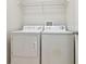 A laundry room with a washer and dryer and storage shelf at 700 S Harbour Island Blvd # 735, Tampa, FL 33602
