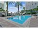 Inviting pool area surrounded by palm trees, lush greenery, and cityscape views, perfect for relaxation and recreation at 700 S Harbour Island Blvd # 735, Tampa, FL 33602
