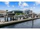 Picturesque waterfront marina with several boats in lifts, framed by the city skyline and a vibrant blue sky at 700 S Harbour Island Blvd # 735, Tampa, FL 33602