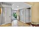 Bright entryway featuring tiled floors, coat closet, and a view to the front yard at 707 Old Mill Pond Rd, Palm Harbor, FL 34683