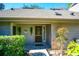 Inviting front entrance with decorative door, stone walkway, and well-maintained landscaping at 707 Old Mill Pond Rd, Palm Harbor, FL 34683