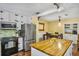 Well-appointed kitchen with stainless steel appliances and ample counter space at 707 Old Mill Pond Rd, Palm Harbor, FL 34683