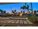 Charming front yard featuring unique turtle stepping stones and lush green grass at 741 Mandalay Ave, Clearwater Beach, FL 33767