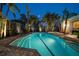 Beautiful pool surrounded by palm trees and lounge chairs, perfect for relaxing evenings at 741 Mandalay Ave, Clearwater Beach, FL 33767