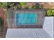 Bird's-eye view highlighting the pool's placement and backyard layout at 8204 Reynolds Dr, Hudson, FL 34667