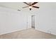 Spacious bedroom with ceiling fan and neutral carpeting provides a cozy atmosphere at 8204 Reynolds Dr, Hudson, FL 34667