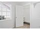 Bright bedroom features a window and closet with shelving for ample storage at 8204 Reynolds Dr, Hudson, FL 34667