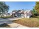 Charming single-Gathering home with a well-manicured lawn, a two-car garage, and a welcoming driveway at 8204 Reynolds Dr, Hudson, FL 34667