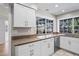 Well lit kitchen with new cabinets, granite countertops and stainless steel appliances at 8204 Reynolds Dr, Hudson, FL 34667