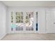Living Room features French doors leading to the screened-in lanai and pool area at 8204 Reynolds Dr, Hudson, FL 34667