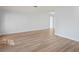 Bright living room features new laminate flooring, fresh neutral paint, and an abundance of natural light at 8204 Reynolds Dr, Hudson, FL 34667