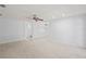 Spacious living room with carpet flooring and neutral paint at 8204 Reynolds Dr, Hudson, FL 34667