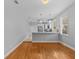 View of the dining room with hardwood floors, showing the open access to the kitchen at 914 S Bruce St, Tampa, FL 33606