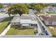 Aerial view of a single-story home with a fenced backyard, patio, and garden at 9201 Lunar Ln, Port Richey, FL 34668