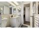 Clean bathroom features a vanity with storage, neutral tile, standard toilet and a bright, inviting ambiance at 9201 Lunar Ln, Port Richey, FL 34668