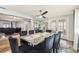 Elegant dining room features a marble table, stylish chairs, ceiling fan, and mirrored wall for an inviting atmosphere at 9201 Lunar Ln, Port Richey, FL 34668