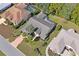 Aerial view of a home with a screened-in pool and well-kept landscaping at 9405 Ashley Dr, Weeki Wachee, FL 34613