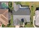 Aerial view showcases a home with a screened pool and well-maintained landscaping at 9405 Ashley Dr, Weeki Wachee, FL 34613