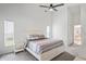 Cozy bedroom with a ceiling fan, carpet flooring and a window offering natural light at 9405 Ashley Dr, Weeki Wachee, FL 34613
