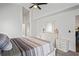 Comfortable bedroom featuring a ceiling fan, neutral paint and carpet flooring at 9405 Ashley Dr, Weeki Wachee, FL 34613