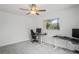 Bright bedroom with an office chair and a window providing natural light at 9405 Ashley Dr, Weeki Wachee, FL 34613