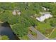 Aerial view of the GlenLakes community clubhouse surrounded by mature trees and landscaping at 9405 Ashley Dr, Weeki Wachee, FL 34613