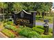 Community sign with manicured landscaping enhances the curb appeal of the GlenLakes neighborhood at 9405 Ashley Dr, Weeki Wachee, FL 34613