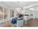 Dining area with seating for four, adjacent to kitchen and living space at 9405 Ashley Dr, Weeki Wachee, FL 34613