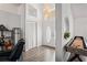 Bright foyer with high ceilings, decorative lighting, and hardwood floors at 9405 Ashley Dr, Weeki Wachee, FL 34613