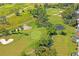 Scenic aerial view of the golf course with green fairways and sand traps at 9405 Ashley Dr, Weeki Wachee, FL 34613