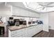 Open-concept kitchen with granite countertops and modern appliances adjacent to the living room at 9405 Ashley Dr, Weeki Wachee, FL 34613