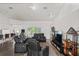Spacious living room with comfortable seating and a view of the backyard at 9405 Ashley Dr, Weeki Wachee, FL 34613