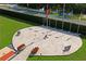 Aerial view of the community memorial which includes pavers, benches, flags, and flowerbeds at 9405 Ashley Dr, Weeki Wachee, FL 34613