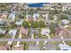 Aerial view of a residential neighborhood with mature trees and well-maintained lawns at 9405 Ashley Dr, Weeki Wachee, FL 34613