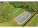 Aerial view of shuffleboard courts surrounded by trees, in a well-maintained park at 9405 Ashley Dr, Weeki Wachee, FL 34613