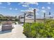 Private boat dock featuring a boat lift, canal, and seating with beautiful neighborhood views at 944 Symphony Isles Blvd, Apollo Beach, FL 33572