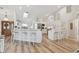 Spacious kitchen with a breakfast bar, modern appliances, and white cabinetry at 944 Symphony Isles Blvd, Apollo Beach, FL 33572