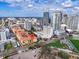 Aerial view of the condo complex with a city skyline backdrop on a sunny day with blue sky at 100 4Th S Ave # 202, St Petersburg, FL 33701