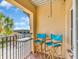 Charming balcony with seating overlooking the palm tree and nearby street at 100 4Th S Ave # 202, St Petersburg, FL 33701