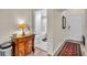 Elegant hallway with a view of the bathroom, featuring stylish furniture and a patterned rug at 100 4Th S Ave # 202, St Petersburg, FL 33701