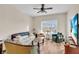 Cozy living room featuring a ceiling fan and natural light from the window at 100 4Th S Ave # 202, St Petersburg, FL 33701