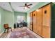 Home office space features wood floors, a ceiling fan, and a large cabinet at 100 4Th S Ave # 202, St Petersburg, FL 33701