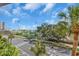 View of a park and parking lot from the property, enhanced by palm trees and sunny skies at 100 4Th S Ave # 202, St Petersburg, FL 33701