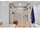 Walk-in shower with tile, glass door, bench, and shower head, with a toilet adjacent at 100 4Th S Ave # 202, St Petersburg, FL 33701