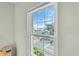 Bright, multi-pane window provides a view of a baseball field and neighborhood street at 100 4Th S Ave # 202, St Petersburg, FL 33701