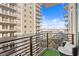 View from balcony showcasing the city skyline with the building's exterior and railings with seating at 1120 E Kennedy Blvd # 1126, Tampa, FL 33602