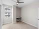 Bedroom showcasing the neutral color palette, ceiling fan, modern window and providing a bright and inviting atmosphere at 1120 E Kennedy Blvd # 1126, Tampa, FL 33602